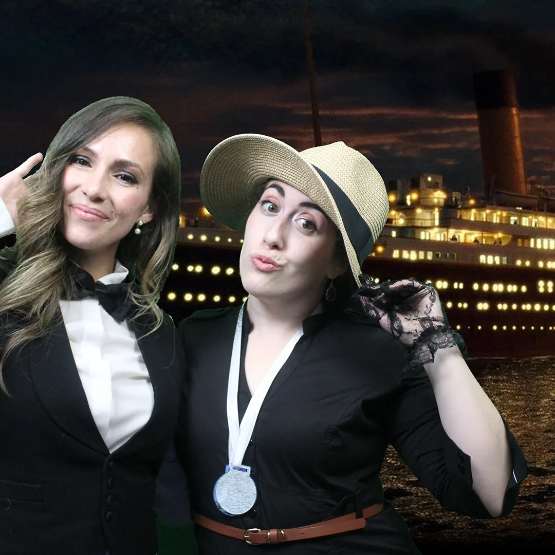 Guests posing together at a green-screen photo booth