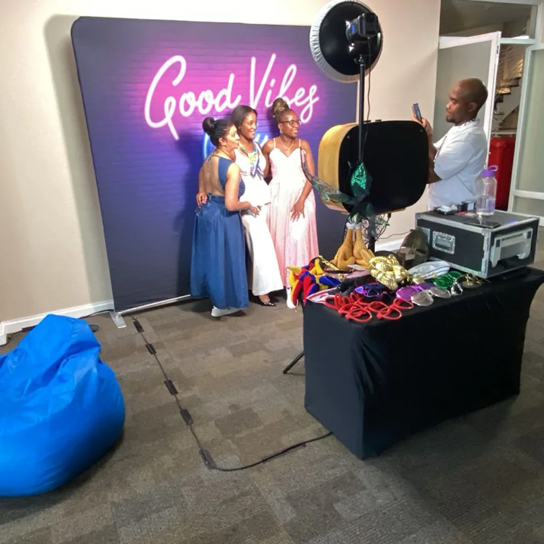 Selfie Cube photo booth arranged beside a decorated event space
